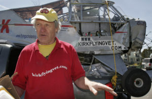 FILE - In this Tuesday, May 1, 2007 file photo, Maurice Kirk talks about and stands next to his damaged World War II-era plane, "Liberty Girl", which he then planned to have restored, in Freeport, Maine. The organizers of a rally of vintage planes flying across Africa say the British pilot Maurice Kirk, 72, went missing Tuesday, Nov. 22, 2016 while flying his 1943 Piper Cub plane and had not arrived at his expected destination in Gambella, Ethiopia. (AP Photo/Pat Wellenbach, File)